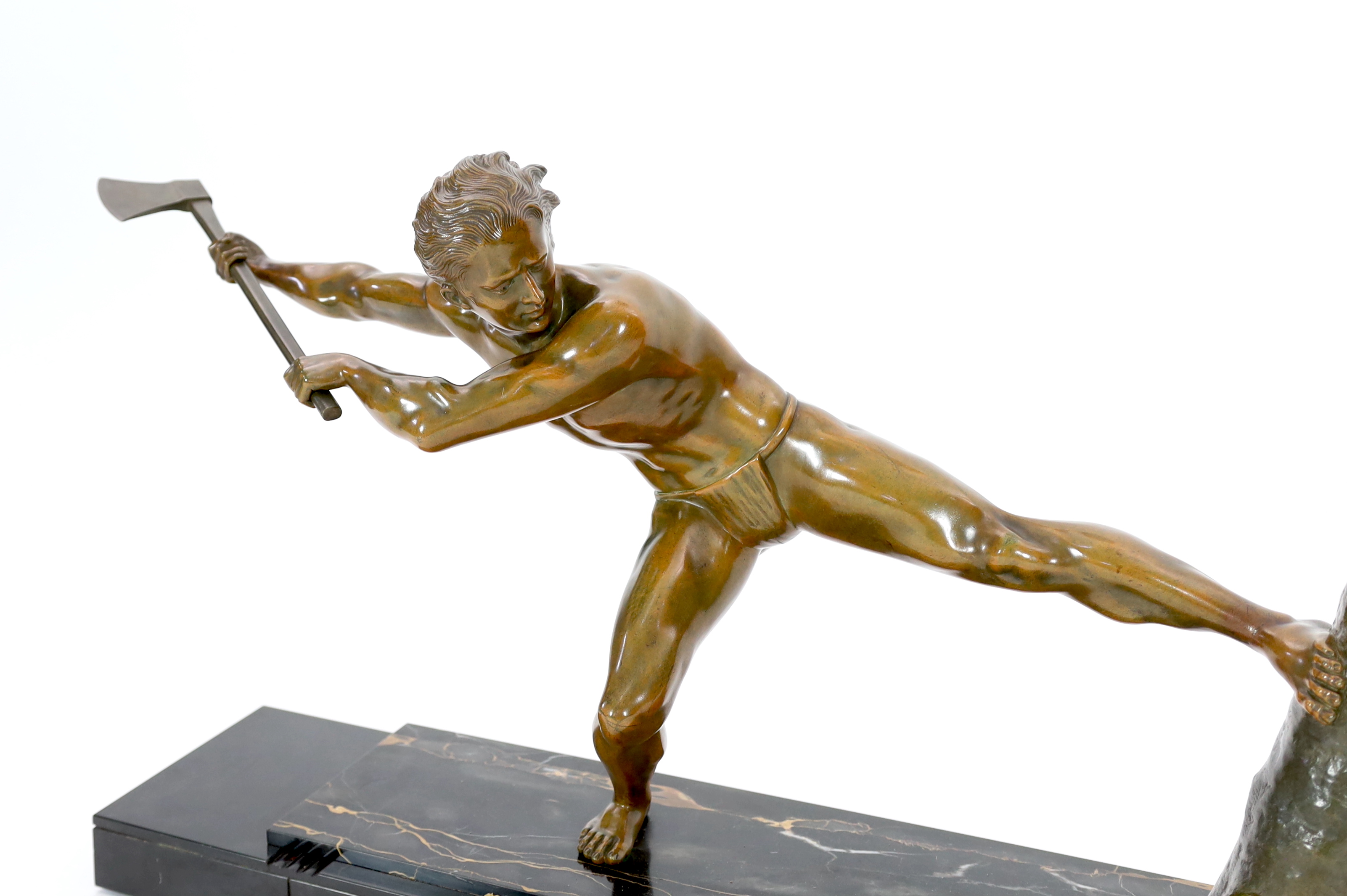 Pierre-Joseph Hugonnet (French, 1801-1885), an Art Deco bronze figure of a woodcutter overall 104cm wide, 20cm deep, 48cm high